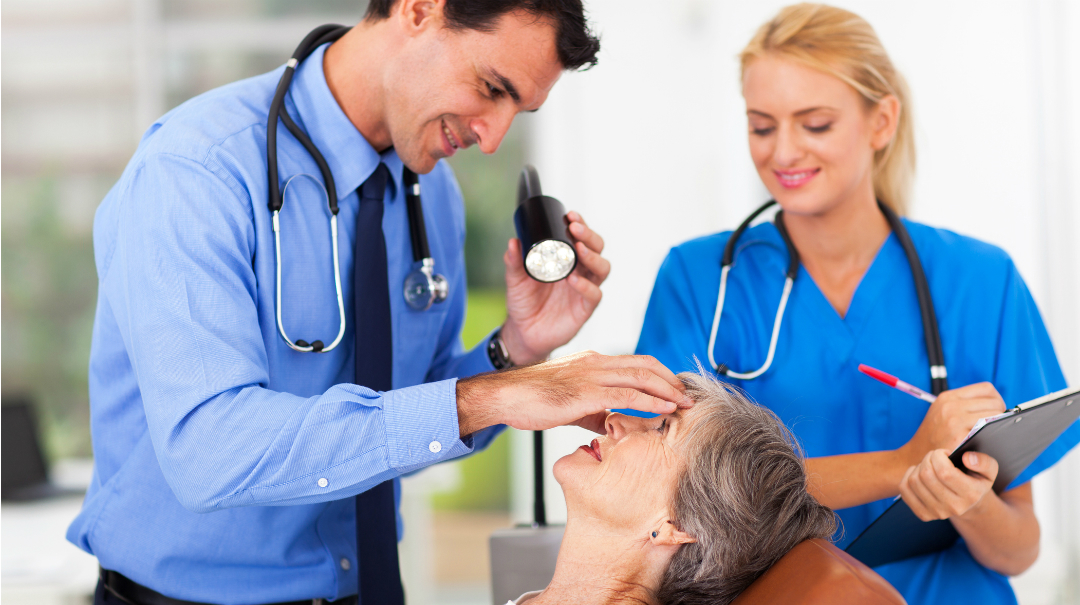 Doctor Face And Blue Eyes In Healthcare Medical Or Surgeon With