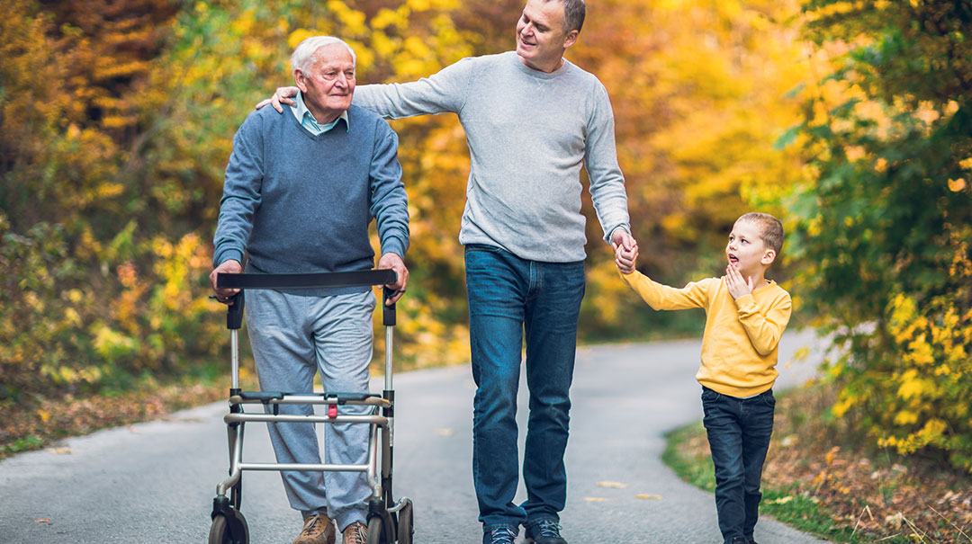 desktop_Elderly-elder-older-man-walks-in-park-with-adult-son-and-grandson_GettyImages-929537264