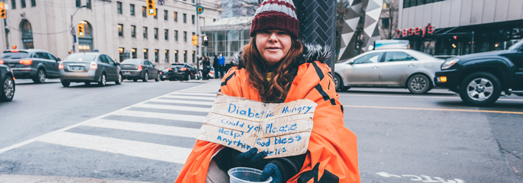 photo-of-woman-sitting-on-sidewalk-3536249