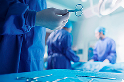 Doctor running CT scan from control room; Digital Composite Image of Surgeon Touching Interface