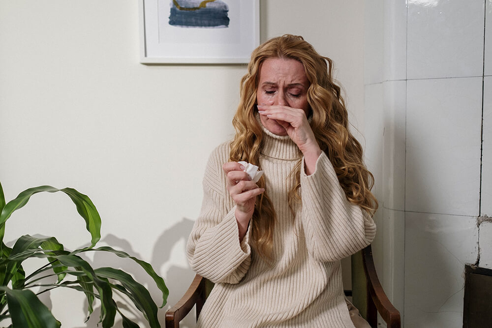 A woman experiencing symptoms of acute rhinosinusitis