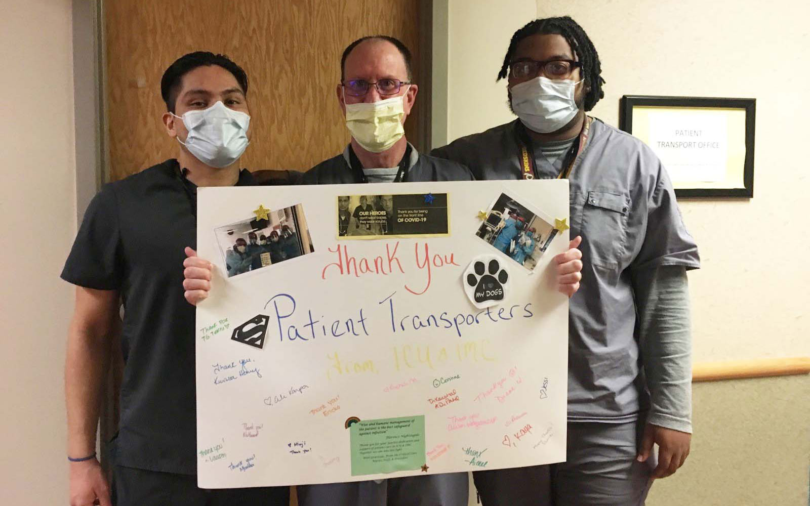 patient transporters holding sign with gratitude messages
