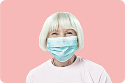 Senior woman smiling with mask on
