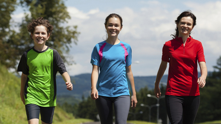 Image of 3 people walking outside