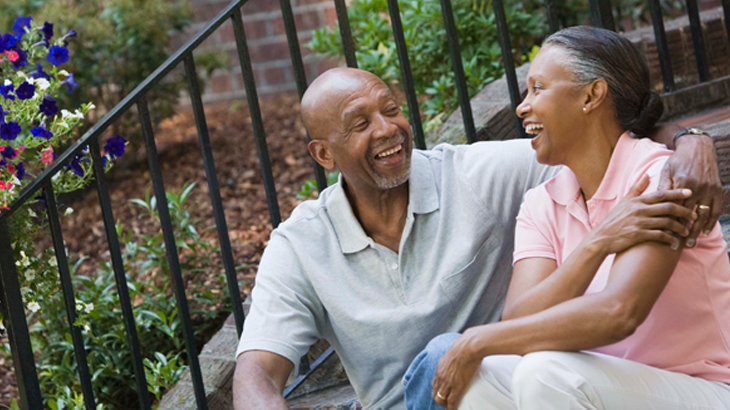 African American couple sitting outside