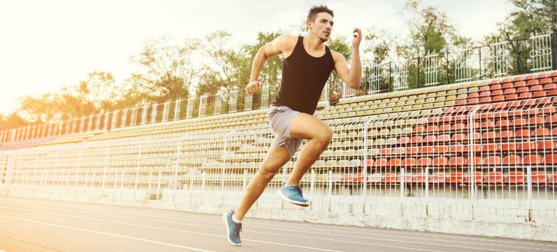 Image of a person running on a track