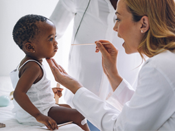 Pediatrics specialist examining girl child