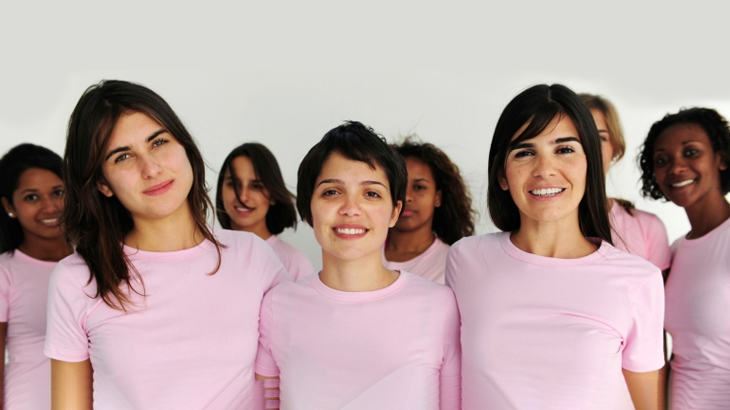 group of women wearing pink