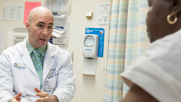 Image of a Healthcare Professional talking with a Head and Neck Cancer Patient