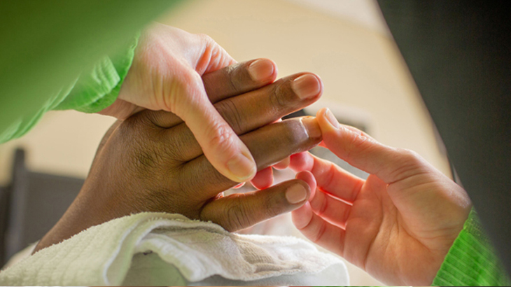 Image of healthcare professional looking at hands