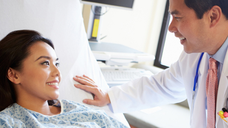 Image of a Dermatologist talking to patient about laser treatment for healthy skin