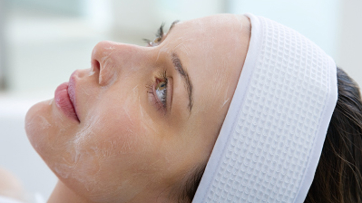 Image of a woman receiving a chemical peel