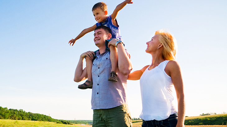 Parents with son walking outside