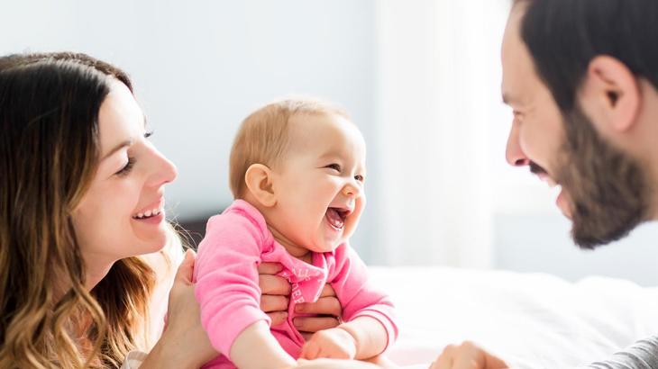 Doctor talking with mother and baby