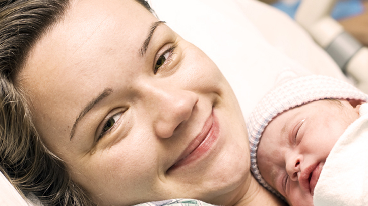 Woman with new born baby