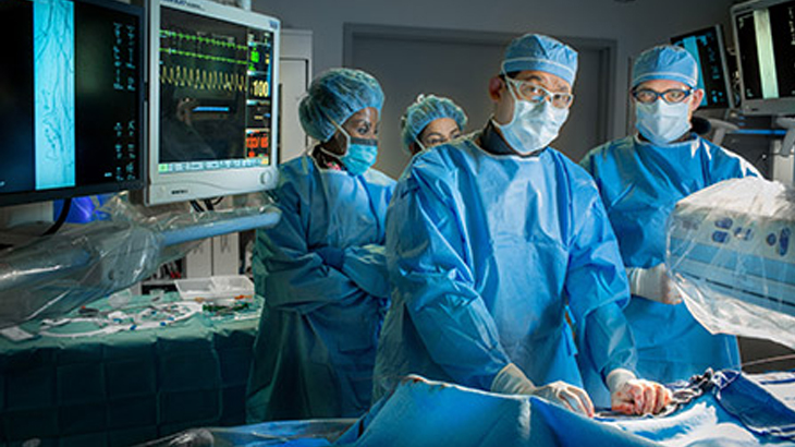 Surgeons operating paitent