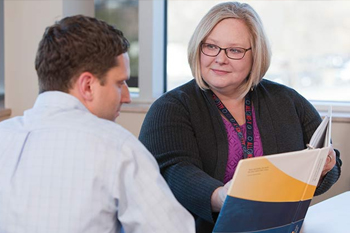 Female doctor talking with patient