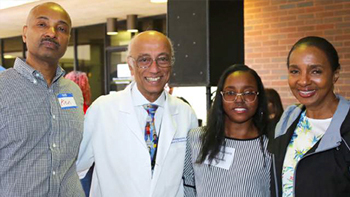 Kenya Lewis, her parents, and Dr. Siva