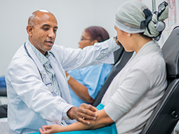 Oncologist giving IV Drip Treatment to Cancer Patient