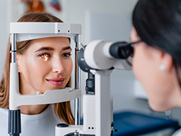 Ophthalmologist with female patient during an examination in modern clinic