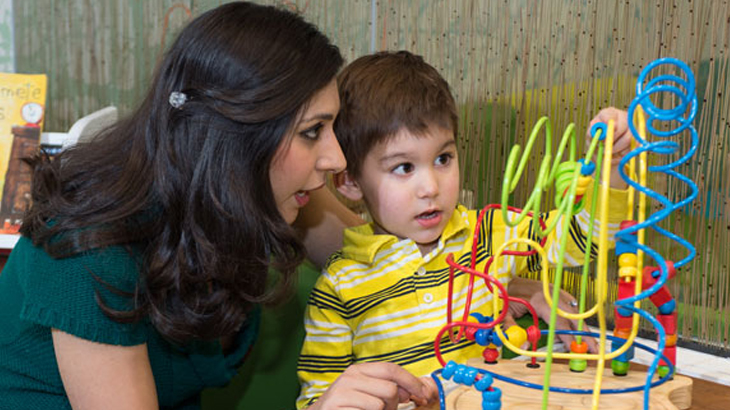 Pediatric expert performing therapy with boy