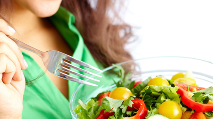 Women eating healthy salad