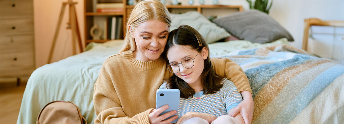 A doctor talks with a female patient during an office visit.