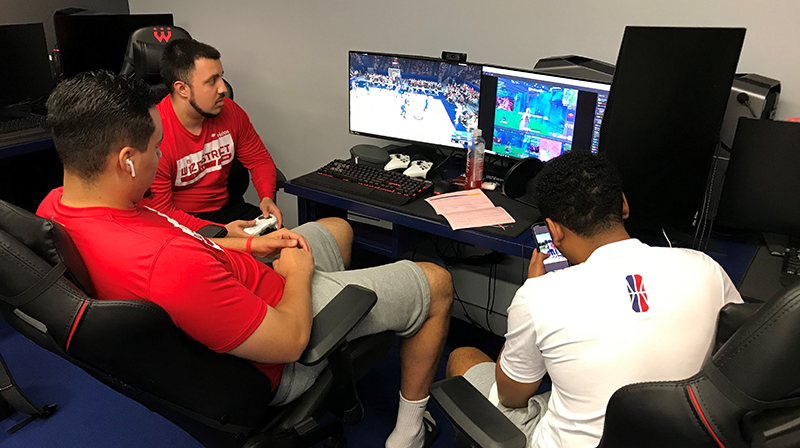 3 gamers playing in the MedStar Wizards District Gaming Studio